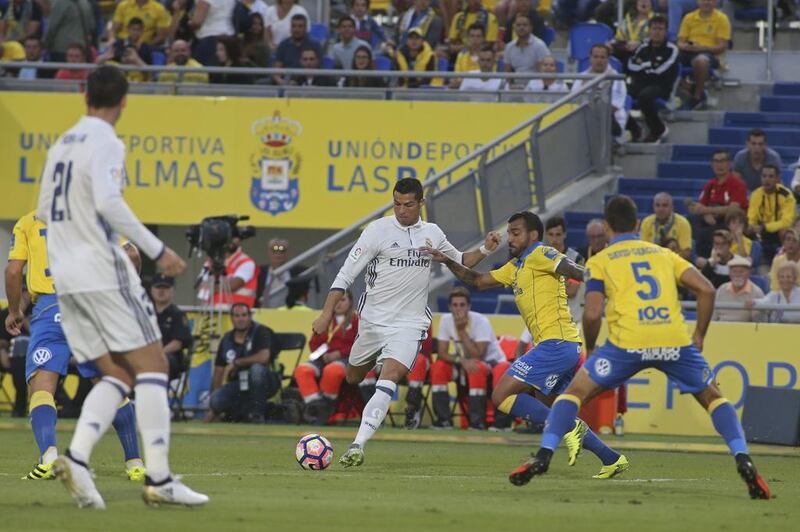 Real Madrid’s Cristiano Ronaldo, centre, prepares to shoot. Jesus de Leon / AP Photo