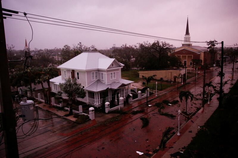 Debris strewn across a street in Fort Myers. Reuters