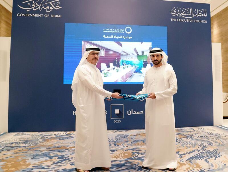 Sheikh Hamdan bin Mohammed hands over the Dubai Electricity and Water Authority the banner of the Hamdan bin Mohammed Program for Government Services 2020. WAM                             