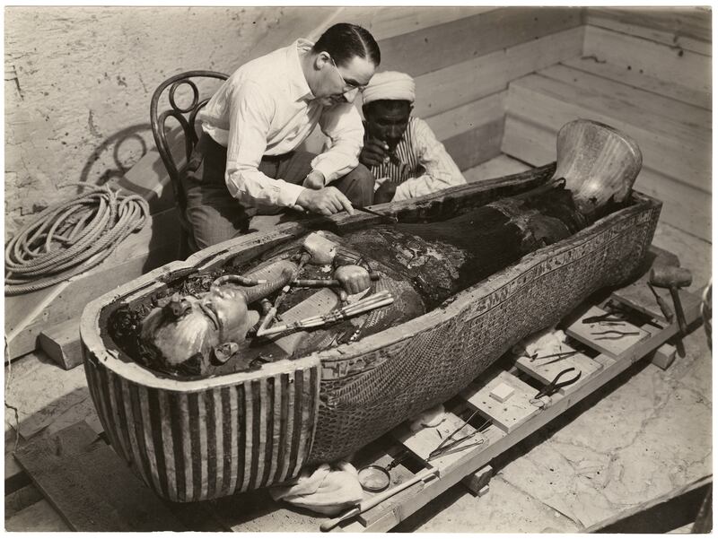 Carter and an Egyptian colleague examining the inner coffin. Photo: The Bodleian Library / University of Oxford