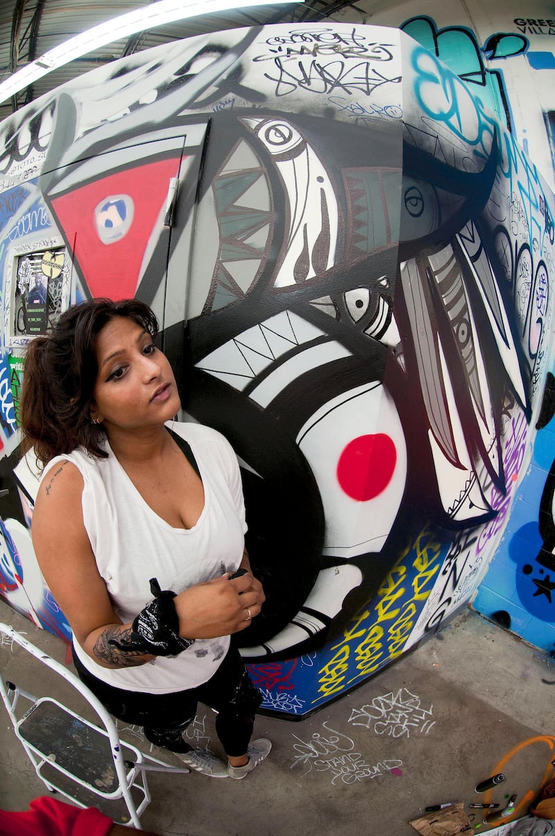handout photo of Dubai-born artist Fathima Mohiuddin doing a mural in New York, taken July 2015. For Ben East story on her painting a mural in London, July 2015 in A&L.
MANDATORY CREDIT: Courtesy Ernie Paniccioli