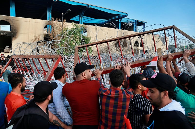 Protesters open the bridge leading to the Green Zone. AP Photo