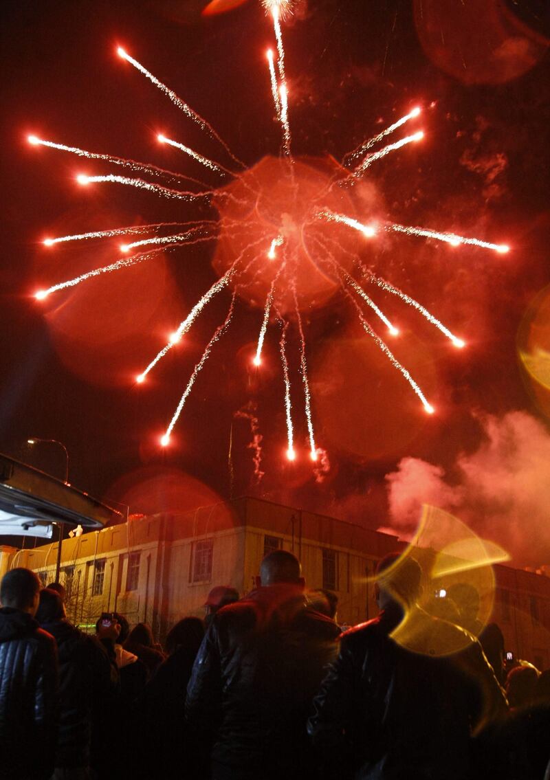 Iraqi Kurds watch fireworks lighting up the sky on New Year's Eve in the capital of Iraqi Kurdistan Arbil at midnight on January 1, 2012. TOPSHOTS      AFP PHOTO/SAFIN HAMED
 *** Local Caption ***  560377-01-08.jpg