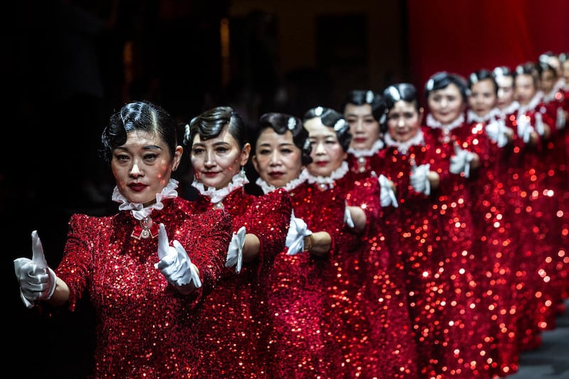 Women model dresses by designer Hu Sheguang to mark the 100th anniversary of the Communist Party of China, in Wuhan, Hubei province. Life in Wuhan is gradually returning to normal, following the outbreak of Covid-19 there. Getty Images