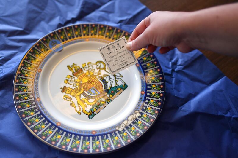 A Jubilee-themed plate is wrapped and boxed on May 17 in Stoke on Trent, England. Halcyon Days holds all three royal warrants to the British royal household as suppliers of objets d'art. Getty