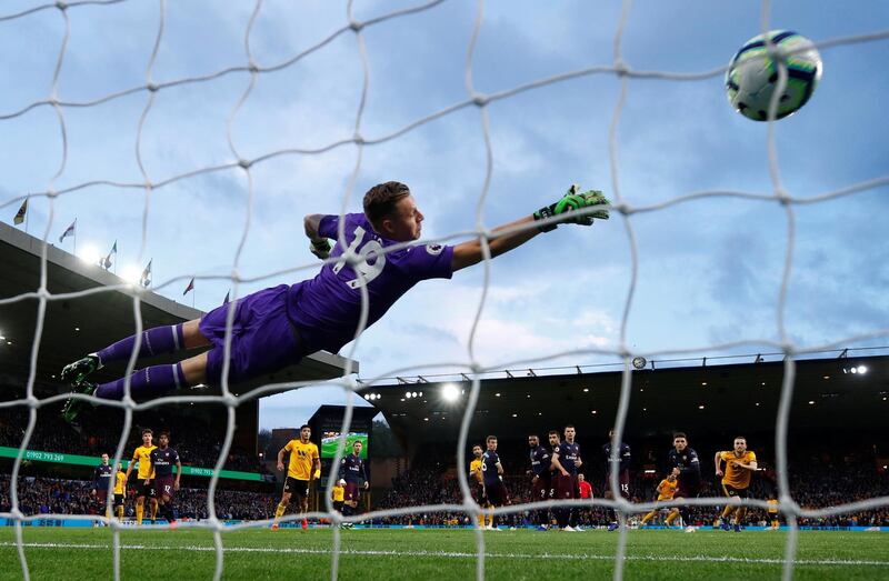Wolverhampton Wanderers' Ruben Neves scores past Arsenal's Bernd Leno. Reuters