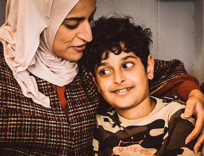 Al-Allak with her son, Jacob, who has continued his great-grandmother's sewing legacy. Photo: Asmaa Al-Allak