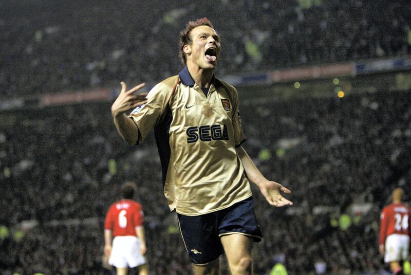 MANCHESTER - MAY 8:  Fredrik Ljungberg of Arsenal celebrates during the FA Barclaycard Premiership match between Manchester United and Arsenal played at Old Trafford, in Manchester, England on May 8, 2002. Arsenal won the match 1-0 to clinch the league title. DIGITAL IMAGE. (Photo by Alex Livesey/Getty Images)
