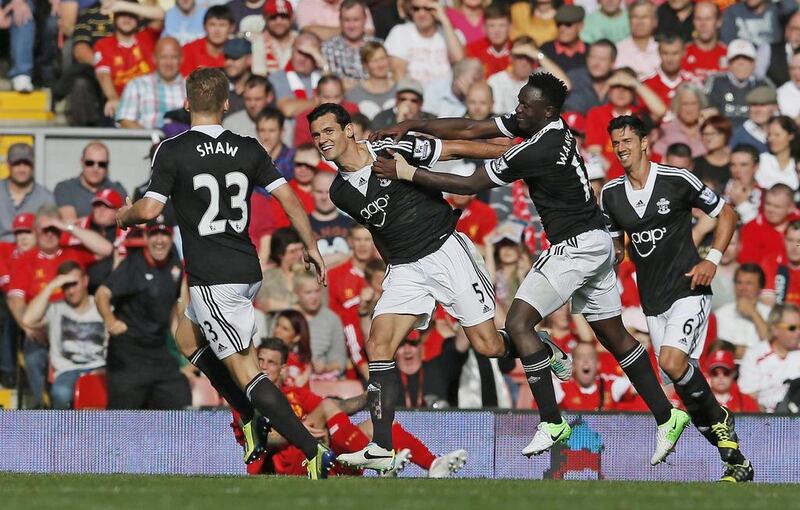 Dejan Lovren, centre, celebrates scoring for Southampton against Liverpool in a Premier League match during the 2013/14 season. Phil Noble / Reuters / September 21, 2013