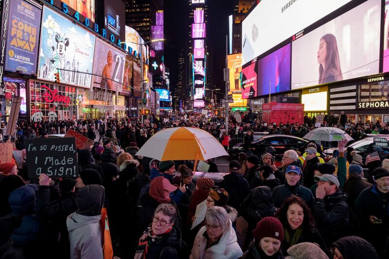 Demonstrators gather to demand the impeachment and removal of US President Donald Trump during a rally at Times Square in New York City. Reuters