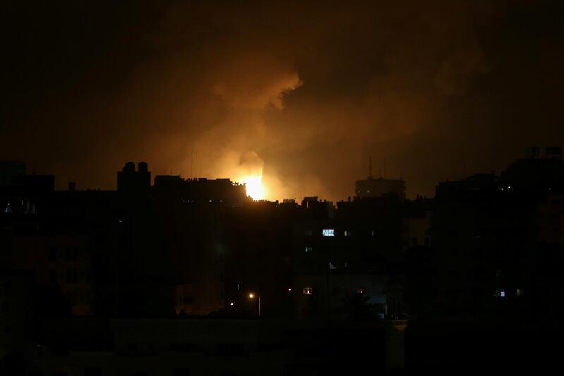 Smoke and flames caused by an Israeli air strike on Gaza city early on Friday. Reuters / Ibraheem Abu Mustafa
