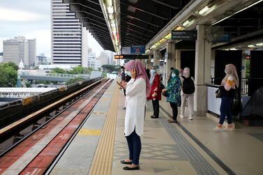 Passengers wait for a Light Rail Transit train at a station in Kuala Lumpur, Malaysia January 14. Reuters