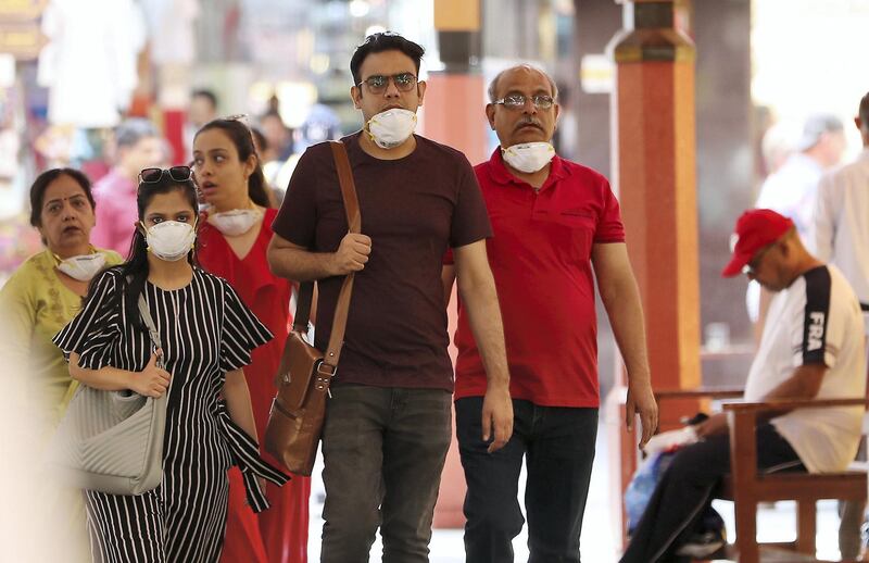DUBAI , UNITED ARAB EMIRATES , Mar 10 – 2020 :- Tourists wearing protective face mask at the Dubai Gold Souk in Deira Dubai. ( Pawan Singh / The National ) For News/Online Story by Kelly