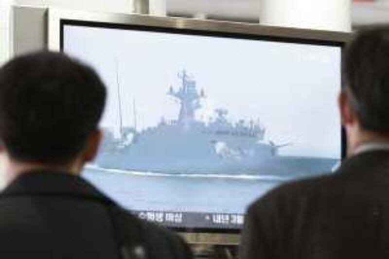 South Koreans watch a television screen showing undated file footage of a South Korean Navy ship near the disputed waters off South Korea's west coast, at a railway station in Seoul, South Korea, Tuesday, Nov. 10, 2009. The two Koreas briefly exchanged naval fire Tuesday along their disputed western sea border, with a North Korean ship suffering heavy damage before retreating, South Korean military officials said. (AP Photo/Ahn Young-joon) *** Local Caption ***  SEL106_South_Korea_Koreas_Naval_Clash.jpg