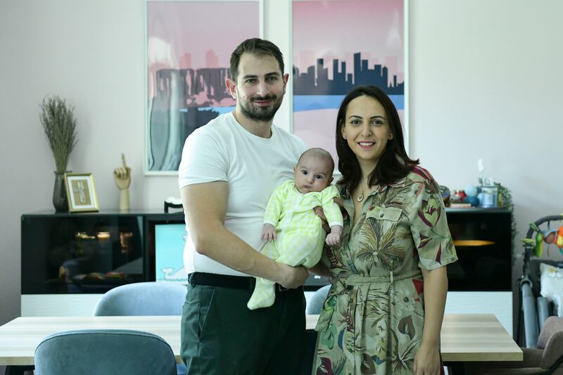 Jad Yammine with his 2-month-old baby Liam and wife Magalie at their home in Abu Dhabi's Al Ghadeer community. All photos: Khushnum Bhandari / The National