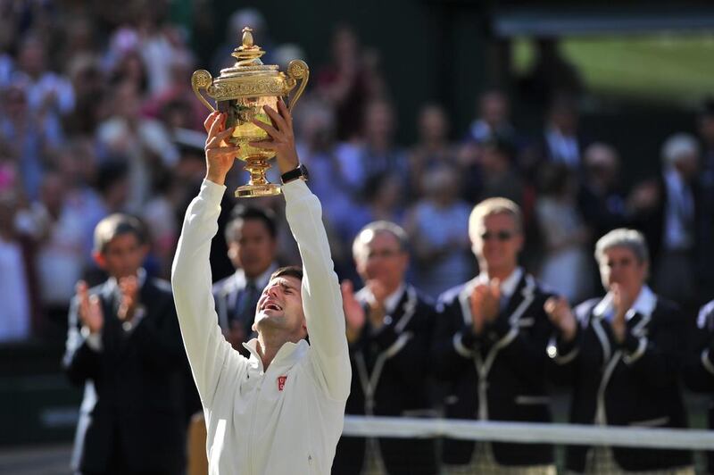 Serbia's Novak Djokovic holds the winner's trophy. AFP