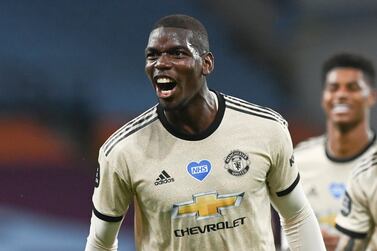Manchester United's Paul Pogba celebrates after scoring his team's third goal during the English Premier League soccer match between Aston Villa and Manchester United at Villa Park in Birmingham, England, Thursday, July 9, 2020. (AP Photo/Shaun Botterill,Pool)