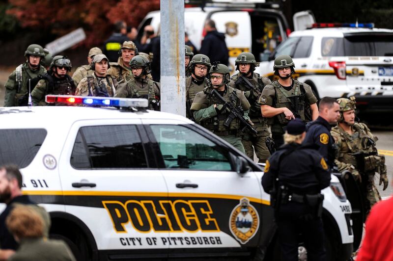 Law enforcement officers secure the scene. AP Photo