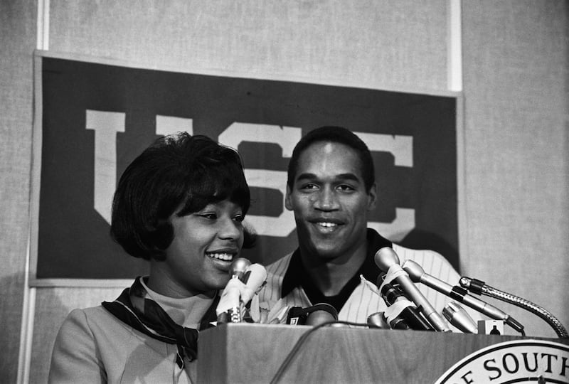 Simpson and his first wife, Marguerite, appear at a press conference. Getty Images
