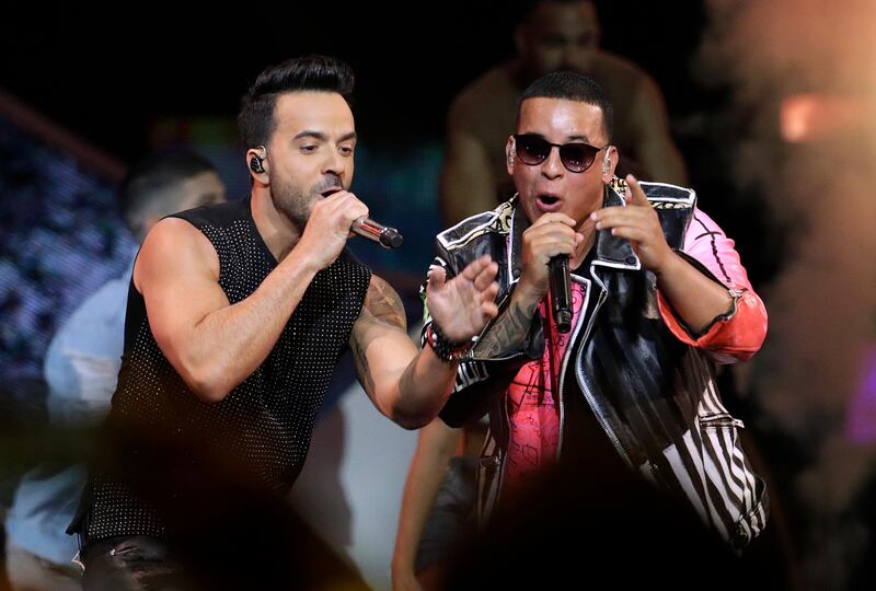 FILE - In this April 27, 2017 file photo, singers Luis Fonsi, left and Daddy Yankee perform during the Latin Billboard Awards in Coral Gables, Fla. On Friday, Aug. 4, 2017, YouTube announced that the music video for the No. 1 hit song â€œDespacitoâ€ has become the most viewed clip on YouTube of all-time. (AP Photo/Lynne Sladky, File)