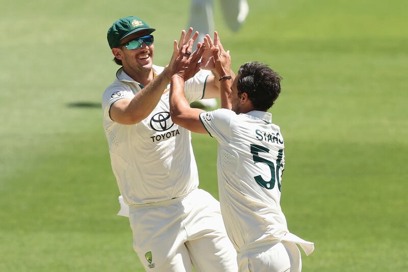 Mitchell Starc of Australia celebrates with Mitchell Marsh after dismissing Abdullah Shafique of Pakistan. Getty Images