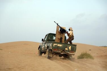 Yemeni forces loyal to the internationally recognised government engage in fighting with Houthi militiamen in the port city of Hodeidah, October 2020. EPA