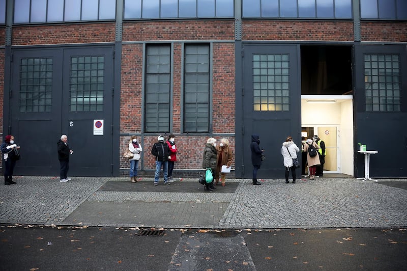 Visitors queue outside a Covid-19 vaccination site at Berlin Arena in Berlin, Germany. Bloomberg