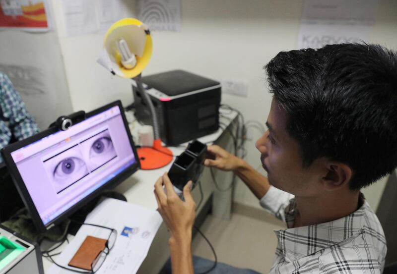 epa06159523 A retina scanner is used for a young boy's unique identification card, or 'Aadhaar' in New Delhi, India, 24 August 2017. Unique 12-digit ID numbers are being issued by the Indian Government to Indian residents as proof of identity.India's Supreme Court on the verdict on unique identification card declared that 'Right to privacy' is a fundamental right.  EPA/RAJAT GUPTA