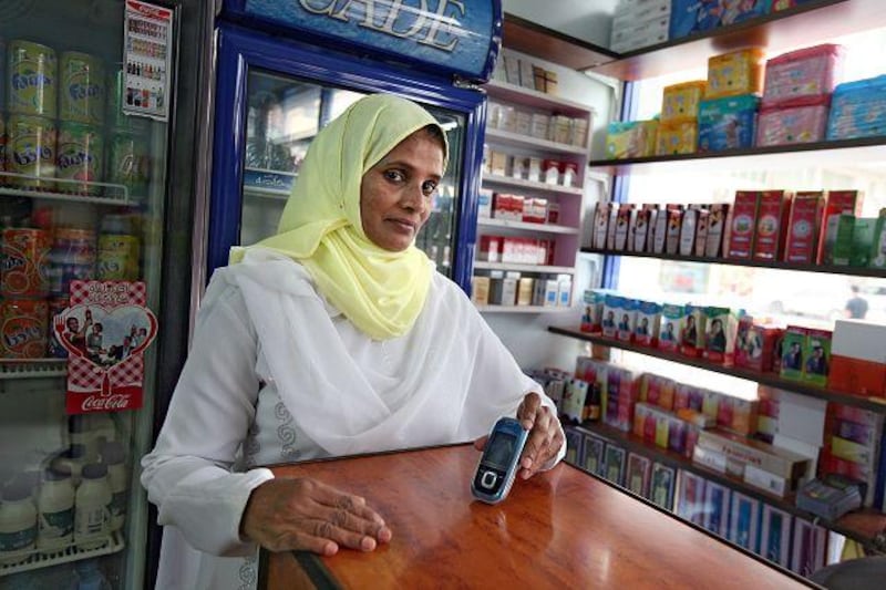 Mariyam Hussain, a shop owner, says she frequently receives texts and calls from fraudsters.