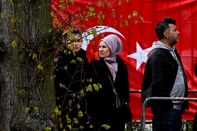 Voters queue at the Turkish embassy in Berlin to cast their ballots in the Turkish presidential and parliamentary elections. EPA