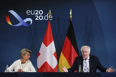 German Interior Minister Horst Seehofer holds a joint news conference with his Swiss counterpart Karin Keller-Sutter over the coronavirus threat. Markus Schreiber/Pool via REUTERS