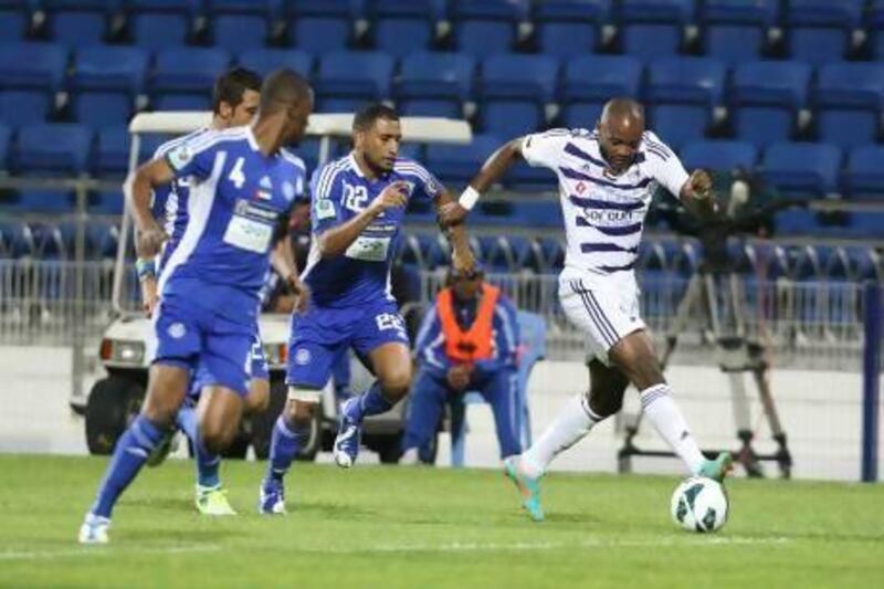Jires Kembo Ekoko, right, the Al Ain forward, caused the Al Nasr defence problems throughout the night as the Pro League champions beat their hosts 2-0 in Dubai. Mike Young / The National