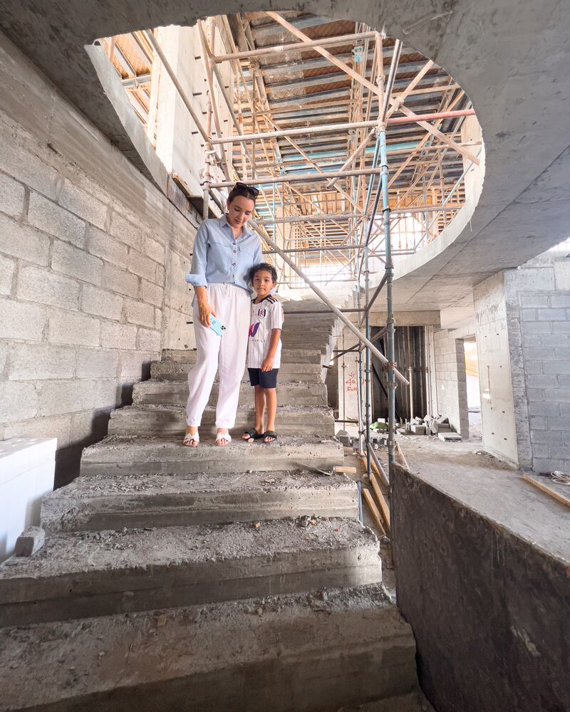 Doble and her son Zayed at the construction site. Photo: Lauren Doble
