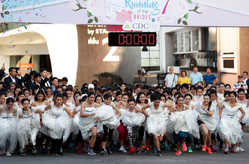 Thai brides-to-be wearing bridal gowns compete in the 'Running of the Brides' event in Bangkok, Thailand.  EPA