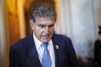 Joe Manchin speaks at the Capitol after the Senate passed the bill. Bloomberg