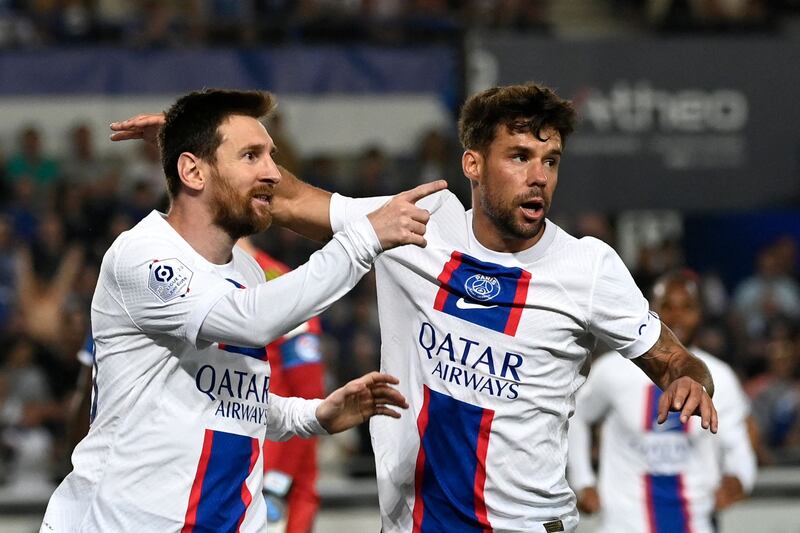 Lionel Messi celebrates with Juan Bernat after scoring for PSG against Strasbourg. AFP