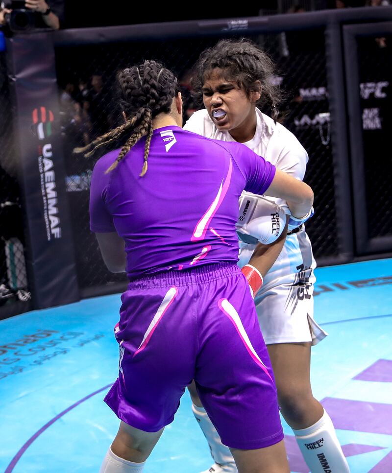 Citlali Perez of Team USA (purple) in action against Palak Nag of India. 