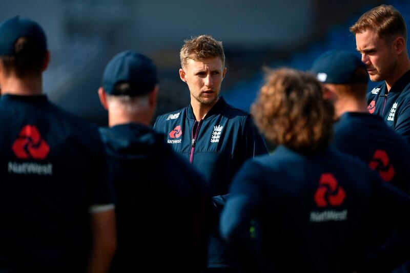 England captain Joe Root talks to his players. AFP