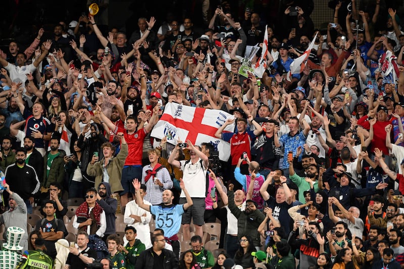 England supporters celebrate victory at the Melbourne Cricket Ground. AFP