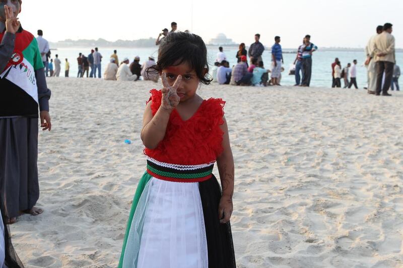 People celebrate National Day along the Corniche in Abu Dhabi. Mona Al-Marzooqi / The National