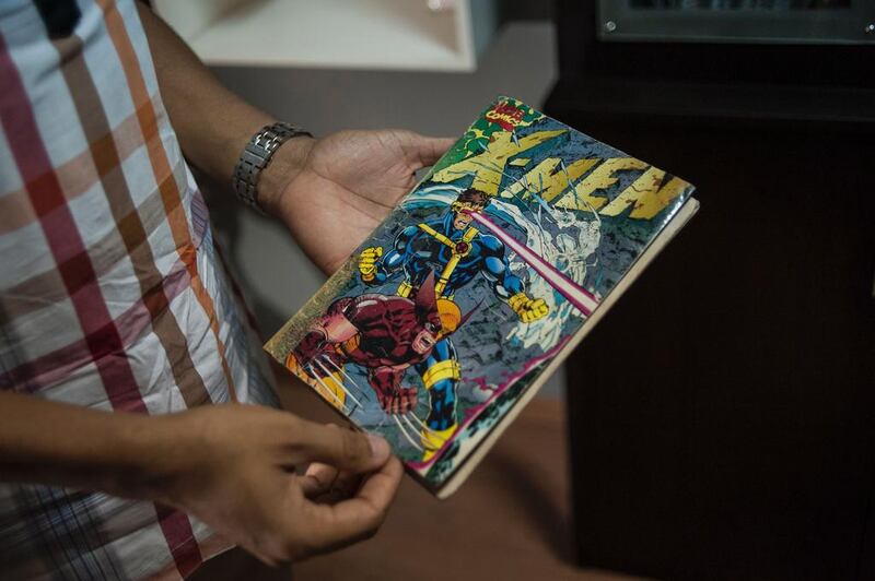 Founder of Comic Republic Jide Martins holds his copy of the best-selling comic book Jim Lee X-Men Vol2 No1 at the Comic Republic office in Lagos. Stefan Heunis / AFP
