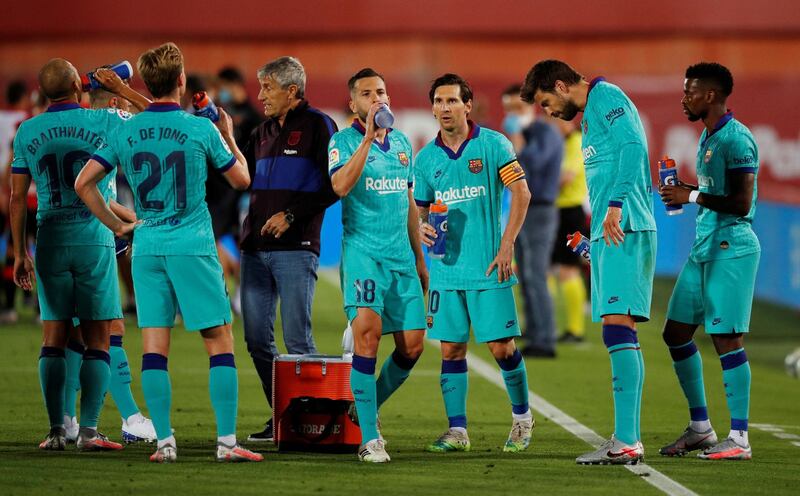 Barcelona players during the drinks break. Reuters