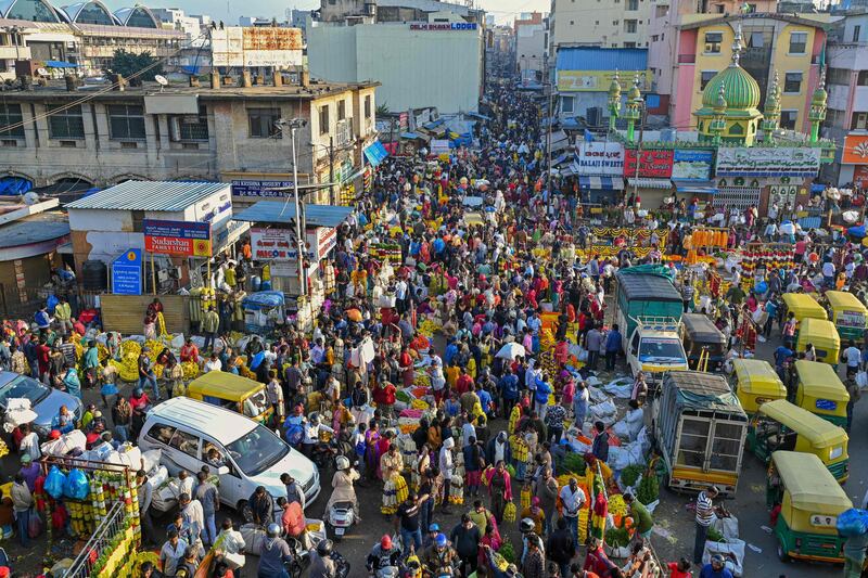 People crowd at a market on the eve of Diwali in Bangalore. AFP