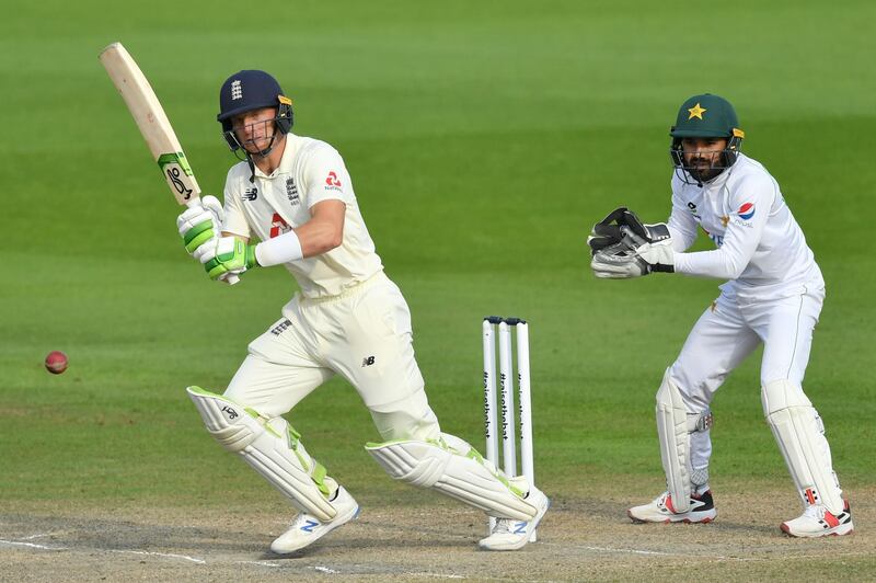 England's Jos Buttler plays a shot as Pakistan's Mohammad Rizwan  keeps wicket. AFP