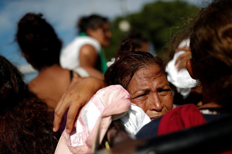 Migrants ride in a municipal police pick-up truck from Pijijiapan to Arriaga, near Pijijiapan, Mexico. Reuters