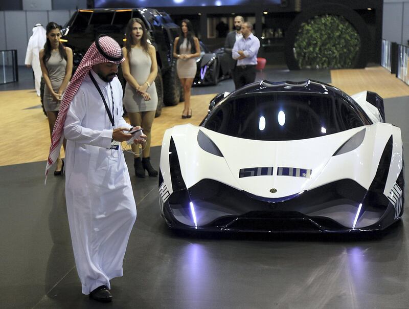 Dubai, 14, Nov, 2017: A visitor walk past the DEVEL Sixteen car at the Dubai International Motor Show in Dubai. Satish Kumar for the National / Story by Adam Workman
