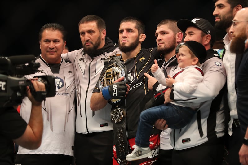 Islam Makhachev with his team and Khabib Nurmagomedov at UFC 280 in Abu Dhabi. Chris Whiteoak / The National