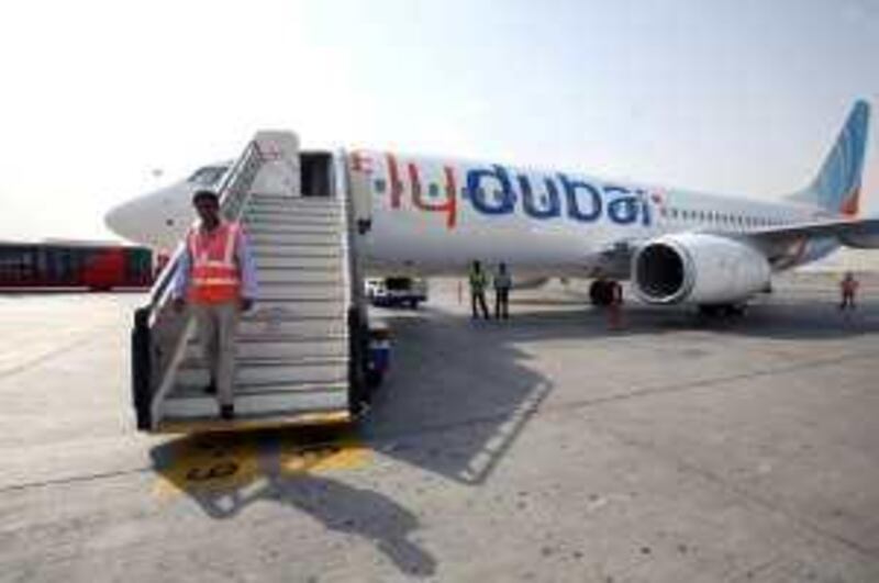 DUBAI, UNITED ARAB EMIRATES - AUGUST 9:  A flydubai plane on the tarmac at Terminal 2 of the Dubai International airport in Dubai on August 9, 2009.  (Randi Sokoloff / The National)  For Stock. *** Local Caption ***  RS005-080909-flydubai.jpg