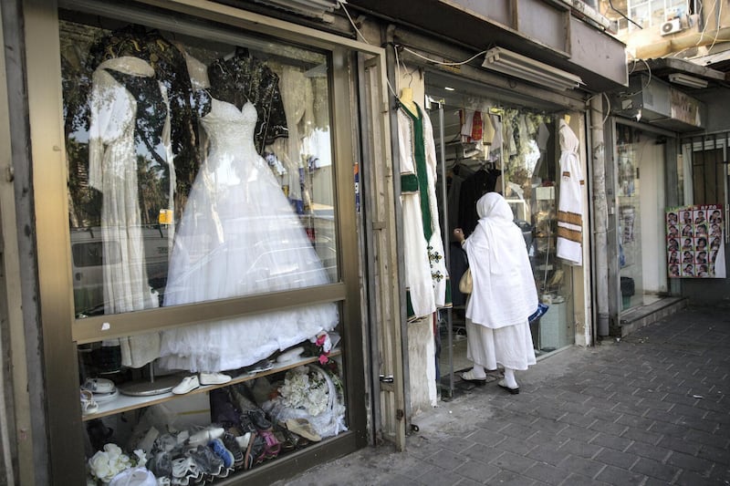 Numerous clothing stores selling traditional African clothing for weddings and other festive events are now common in south Tel Aviv on March 19,2018.The Israeli government is trying to carry out a plan to expel over 38,000 African migrants currently living in Israel.(Photo by Heidi Levine for The National).