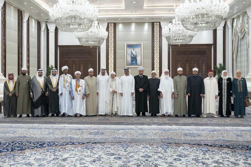 ABU DHABI, UNITED ARAB EMIRATES - May 15, 2019: HH Sheikh Hamed bin Zayed Al Nahyan, Chairman of the Crown Prince Court of Abu Dhabi and Abu Dhabi Executive Council Member (10th L), stands for a group photograph with Islamic scholars and guests of the UAE President, during an Iftar reception at Al Bateen Palace. Seen with HE Dr Mohamed Matar Salem bin Abid Al Kaabi, Chairman of the UAE General Authority of Islamic Affairs and Endowments (8th L) and HE Shaykh Abdallah bin Bayyah (9th L).

( Eissa Al Hammadi for the Ministry of Presidential Affairs )
---